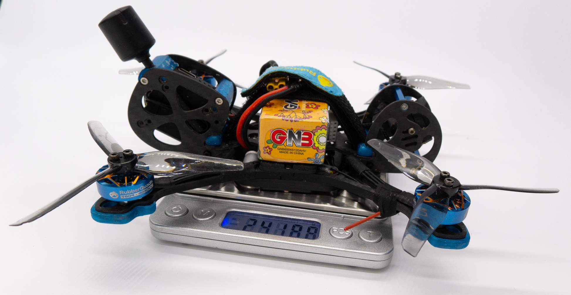 Squirrel 35 on the scale showing 242g with battery